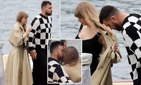 The Grammy winner and Kansas City Chiefs tight end were seen posing for photos on the boat why celebrating